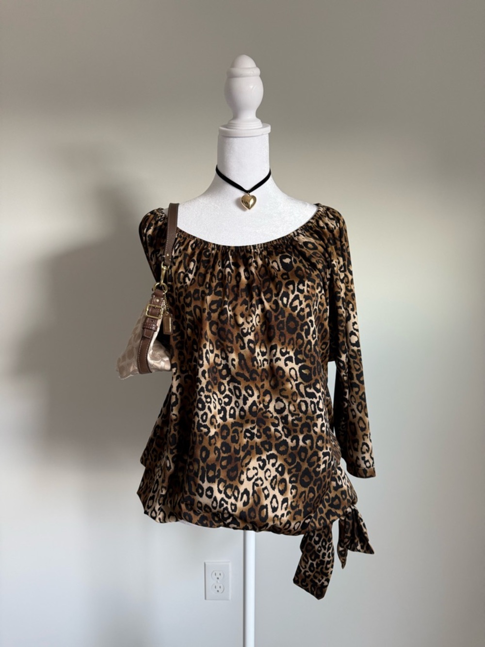 Leopard print off-the-shoulder top with a tie detail
